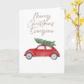 車の屋根の上のシンプルなクリスマスツリー カード (黄色い花)