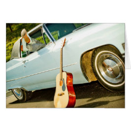 車窓にカウボーイブーツとギターウエスタンカード