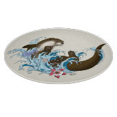 遊び心あふれる青いカワウソの水しぶき カッティングボード (角)