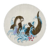 遊び心あふれる青いカワウソの水しぶき カッティングボード (正面)