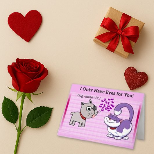 遊び心のあるピンクの漫画犬と猫のラブ シーズンカード
