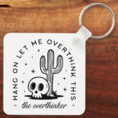 過剰思考のおもしろい引用文 キーホルダー (裏面)