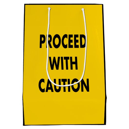 道路標識に注意を払って進む ミディアムペーパーバッグ (裏面)