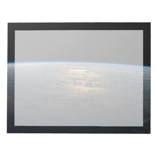 部分的に曇った南太平洋から夕暮れ光る ノートパッド (正面)