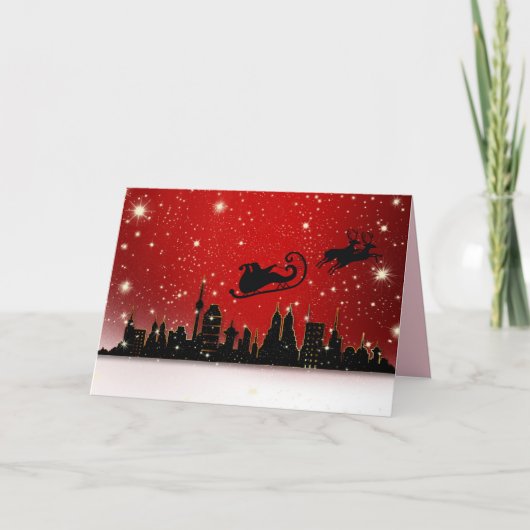 都市の上空にサンタのクリスマスカード カード (正面)