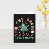 重いクリスマスツリーのジムを持ち上げる季節 カード (黄色い花)