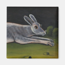 野原を跳び越える長い灰色のうさぎ