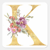 金のモノグラムのKと花