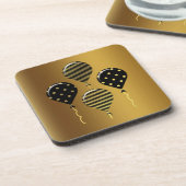 金ゴールドおよび黒フェスティバルバルーン コースター (左側)