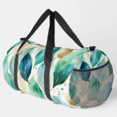 金ゴールドとティール（緑がかった色）の水色の葉のパターン ダッフルバッグ (右コーナー)