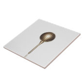 金ゴールドのゴルフ・ボールおよびティー タイル (側面)