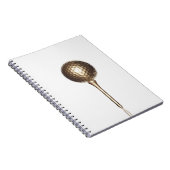 金ゴールドのゴルフ・ボールおよびティー ノートブック (右側)