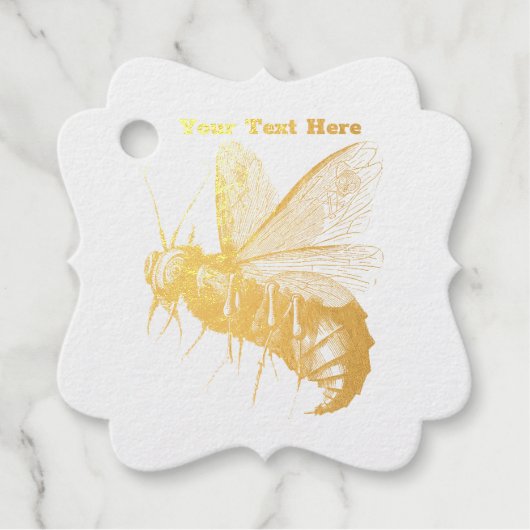 金ゴールドの不気味なゴシックビーのスカルが羽に フェイバータグ (正面)