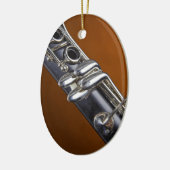 金ゴールドの背景のオーナメントが付いているクラリネット セラミックオーナメント (左)