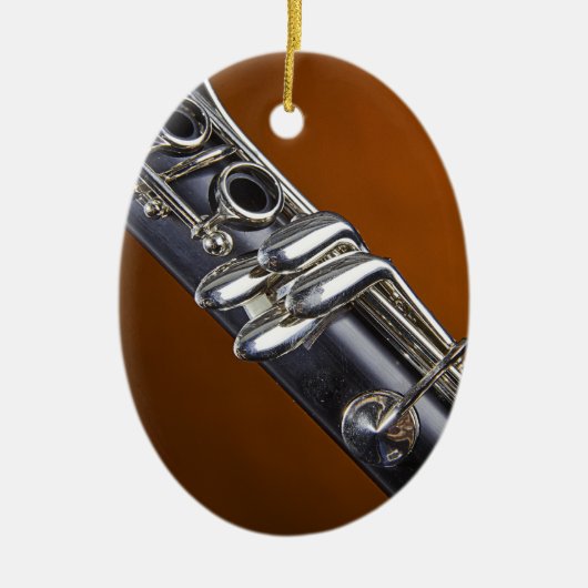 金ゴールドの背景のオーナメントが付いているクラリネット セラミックオーナメント (正面)