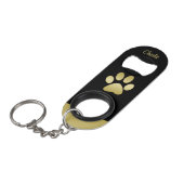 金ゴールドシャイニーな犬の手を黒い背景に キーホルダー栓抜き (正面アングル)