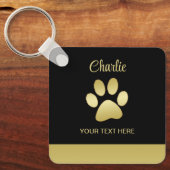 金ゴールドシャイニーな犬の手を黒い背景に キーホルダー (正面)