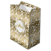 金ゴールドトーンのフローラが白い背景で減衰 ミディアムペーパーバッグ (裏面アングル)