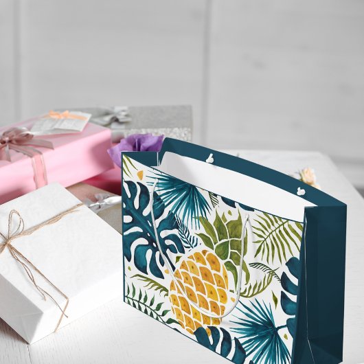 金ゴールドパイナップルのヤシの葉が緑がかった青色の熱帯性 ラージペーパーバッグ