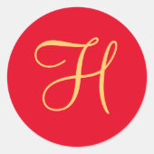 金ゴールド色のイニシャルHを赤で塗る ラウンドシール (正面)