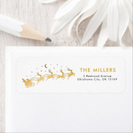 金ゴールド飛んでいるサンタはトナカイを乗せたソリで ラベル