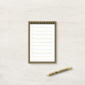 金ゴールド黒い枠の線が付いた後のメモ ポストイット (デスク上)