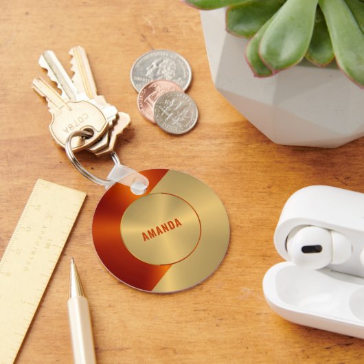 金属金ゴールドと赤色の幾何学的デザイン キーホルダー (デスク)