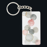 金球 キーホルダー<br><div class="desc">ギルド・スフィアI by Grace Popp.さまざまな面に水色のグレーとピンクの円が特徴。</div>
