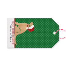 金色のクリスマスギフトタググリーンを持っている