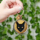 金色の円を背景にした黒猫のシルエット キーホルダー (手)