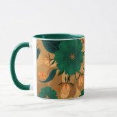金色の背景を持つ緑とオレンジの花模様 マグカップ (左)