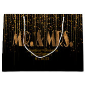 金銅の星のシャワーおよび黒 ラージペーパーバッグ (正面)