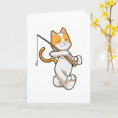 釣り竿で釣りをしている猫 カード (黄色い花)