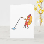 釣り竿で釣りをしながらホットドッグ カード (黄色い花)