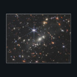 銀河系クラスタSmacs 0723。 ポストカード<br><div class="desc">数千の銀河系が銀河系クラスタSMACS 0723のこの近赤外線イメージを洪水に見舞う。ジェームズ・ウェッブ宇宙望遠鏡による高解像度イメージングと重力レンズによる自然効果を組み合わせることで、この微細な画像を可能にした。最初に、レンズを担当する銀河系に焦点を当てる：画像の中心にある明るい白の楕円形の銀河系と画像全体の小さい白の銀河系。銀河系群の重力によって結び付けられ、彼らは背後の広大な距離に現れる銀河系から光を曲げている。銀河系と暗黒物質の複合質量は宇宙望遠鏡として機能し、個々の銀河系の拡大歪み、時には鏡像化された画像を作成する。ミラー澄んリングの例は、最も明るいクラスタ銀河系の右側と右側に離れの目立つオレンジ色の円弧に見られる。これらの銀河系はレンズ化され、個々の銀河系は1つの円弧に2回表示される。Webbの画像は、星で満たされた明るいコアと、その縁に沿ってオレンジ色の星団を完全に明らかにした。このフィールドのすべての銀河系がミラー化されていない。一部のデバイスがストレッチされている。他の人々は他の銀河系との相互作用によって散らばって見える離れ、彼らの背後にある星の軌跡。明るい中央の銀河系の垂直な回折突起の下端の近くに、長いオレンジ色の弧のすぐ右に、星のクラスタで斑点のある1つの回折図形が現れる。細長いラディバグのような銀河系は星形成のポケットで囲まれている。この銀河系は非常に拡大され、個々の星団は非常に鮮明であるため、研究者は、これまで遠く離れた銀河系には不可能だった絶妙な詳細でそれを勉強することができる。このシーンで最も遠い銀河系遠くに – クラスターの背後に位置する最も小さい銀河系 – は、ローカルの宇宙で観察される渦巻き状と楕円形の銀河系に似ていない。彼らはもっと不器用で不規則だ。Webbの非常に詳細な画像は、研究者が救済、これらの遠い銀河系の中で星のクラスターの年齢と質量を測定する可能性がある。これは、銀河系が新しい成長の小さな芽を芽に出し、活発に相互作用し、融合し、まだ大きならせん状に発展していなかった宇宙春に存在する銀河系のより正確なモデルにつながる可能性がある。</div>