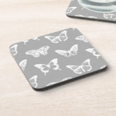 銀色の灰色と白の蝶のスケッチ コースター (左側)
