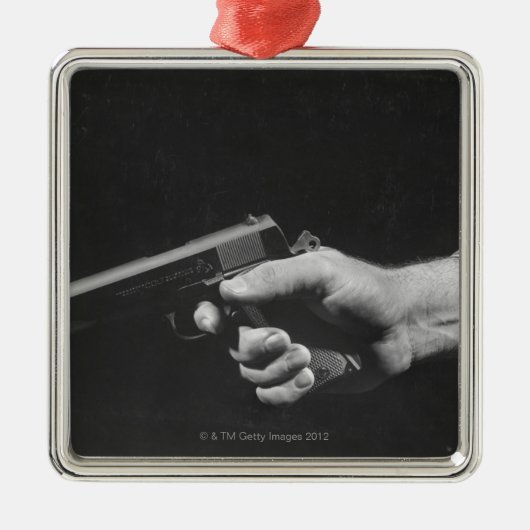 銃を握っている人 メタルオーナメント (正面)