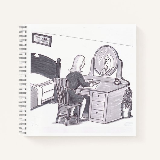 鏡の前で机に向かって座る女性が書き物をする ノートブック (正面)