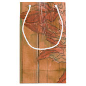 除去されたモダン背景のオレンジ色のフローラプリント スモールペーパーバッグ (裏面)