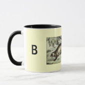 陰で中傷するアナグマ マグカップ (左)