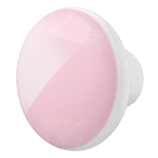 陶磁器のノブのあたりで影で覆われる淡いピンク セラミックノブ (右)