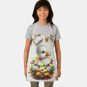 陽気なクリスマスの小さなアヒルが光に絡まっていた エプロン (インサイチュ)