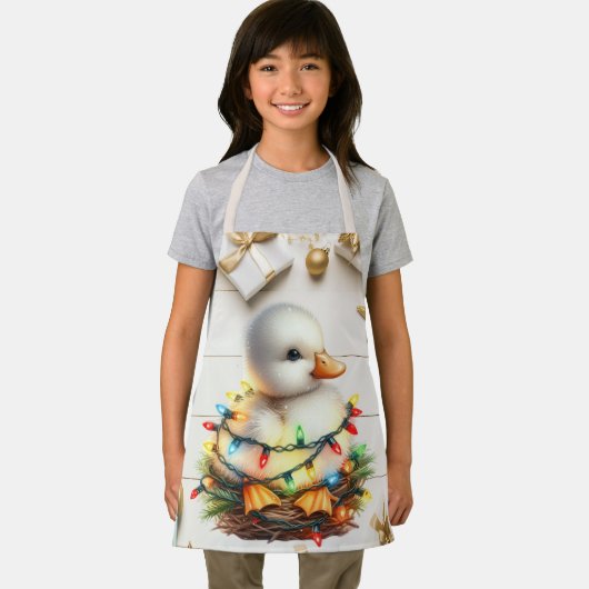 陽気なクリスマスの小さなアヒルが光に絡まっていた エプロン (インサイチュ)