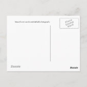 雄のゴールドアイが氷上で羽ばたく ポストカード (裏面)