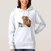 雑誌の前に座っている犬