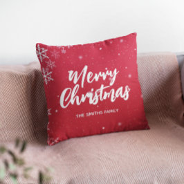 雪が積もった聖降誕祭の赤い背景 クッション