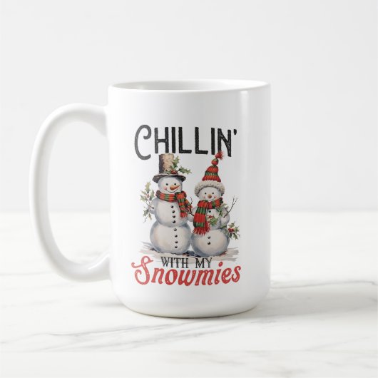 雪が降るチリンかわいい雪だるま コーヒーマグカップ (左)