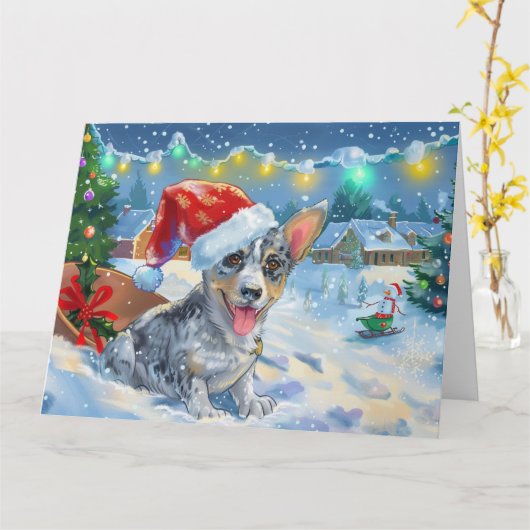 雪そりのクリスマスに青いヒーラー犬 カード (黄色い花)