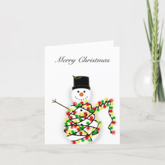 雪だるまが光に絡まる – クリスマスカード