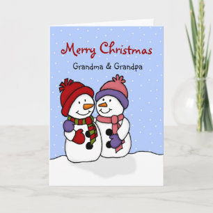 雪だるまのクリスマスカードを抱き締めること シーズンカード